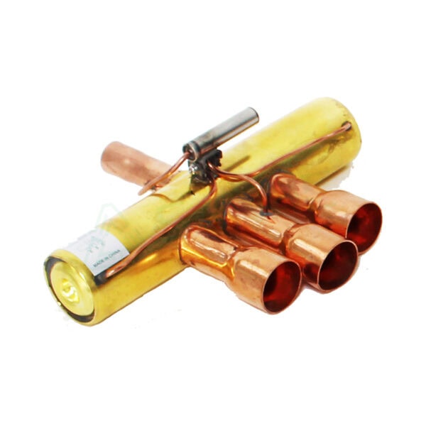 A homemade explosive device with a yellow cylindrical component and copper tubes connected by wires, used as a dangerous improvised explosive.
